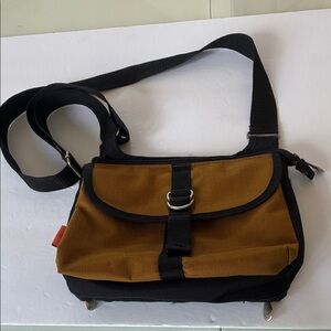 Ampac travel Crossbody handbag
Dark gold and black 
9” x 11” x 2.5”